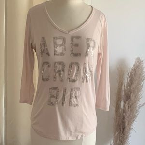 Abercrombie Long Sleeve Light Pink With Squin Writing Size Medium